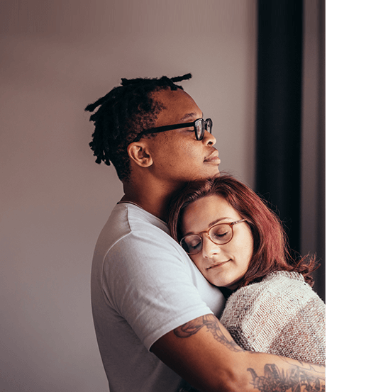 A couple hugging each other.